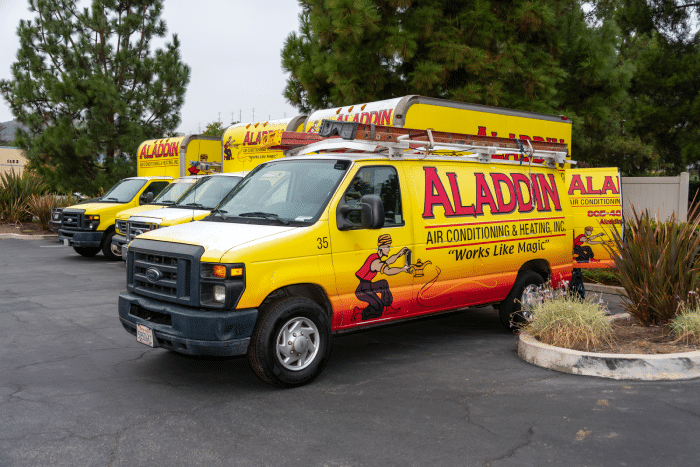 Aladdin Air Conditioning & Heating work van parked with the vehicle's back doors open