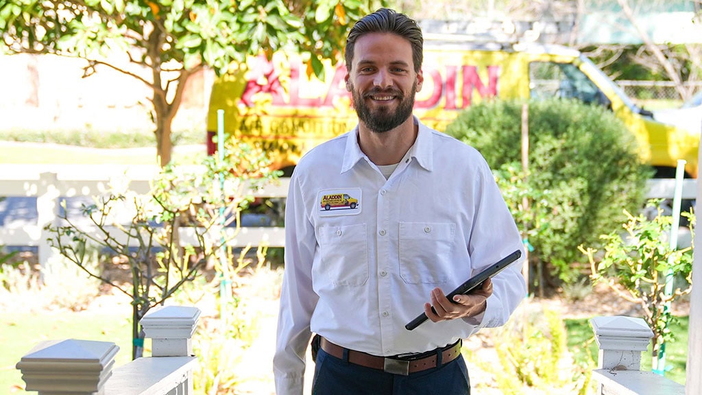 An Aladdin Air Conditioning & Heating comfort specialist greeting you at your front door.