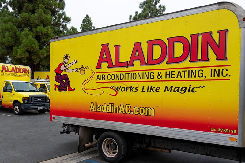 Aladdin HVAC truck in parking lot outside of warehouse.