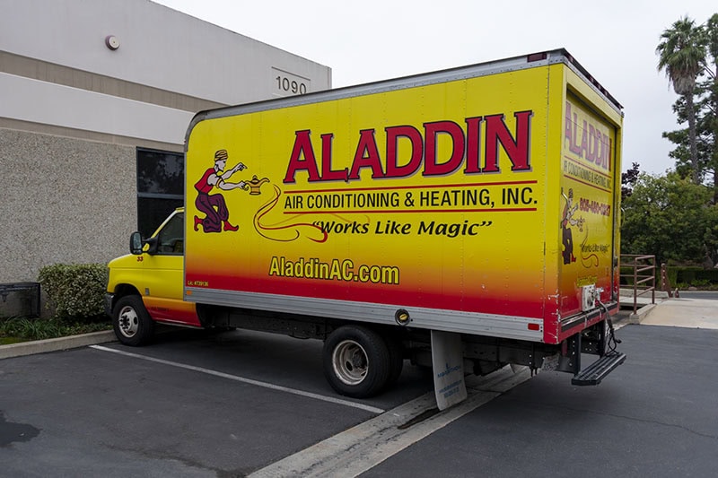 aladdin ac and heating van parked at the building.